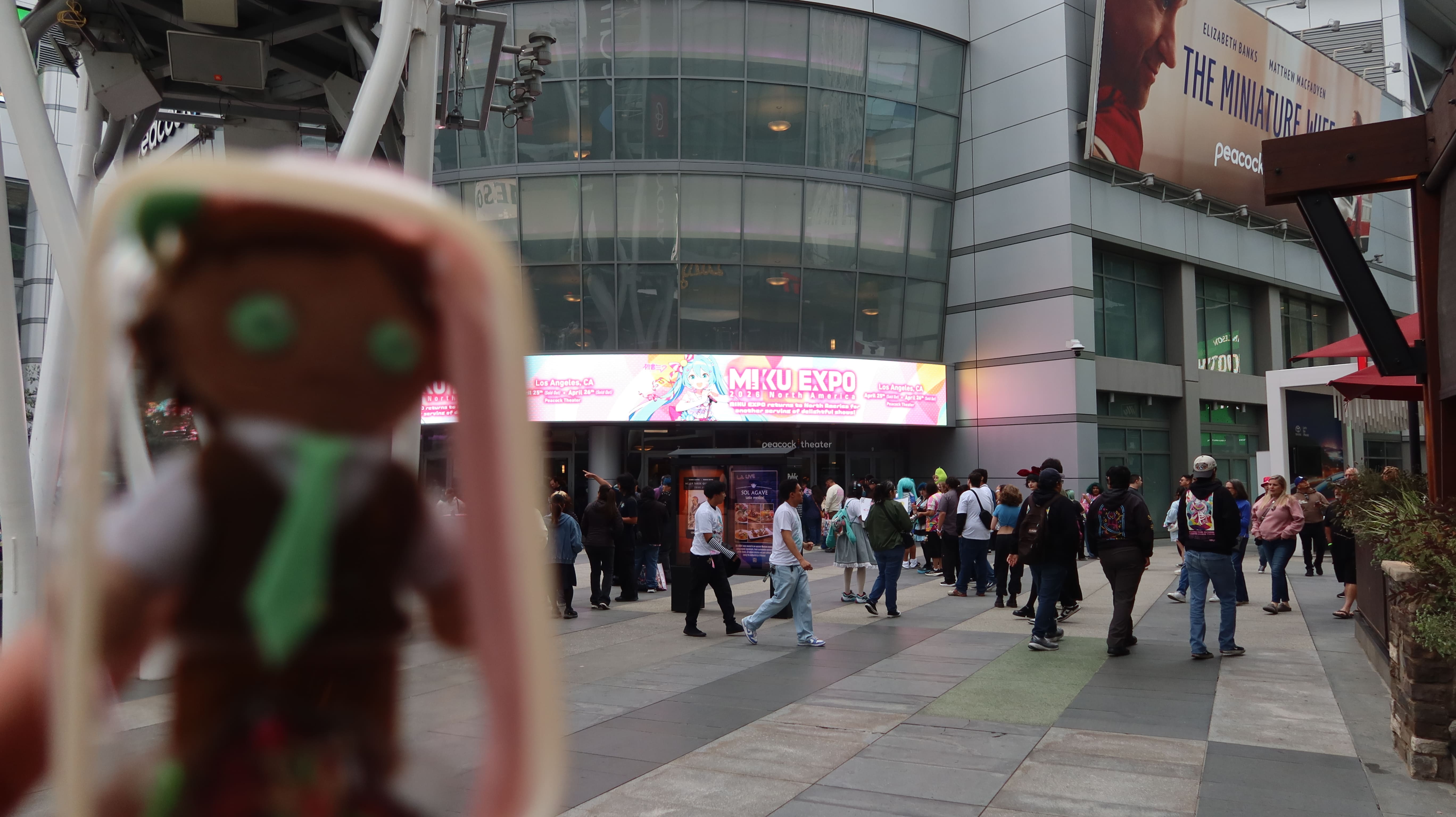 Mog2 Plush in front of the Miku Expo 2026 sign at the Peacock Theater